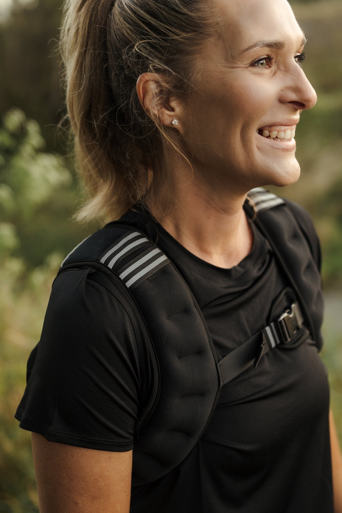 A lady wearing a black weighted VestFit NZ vest