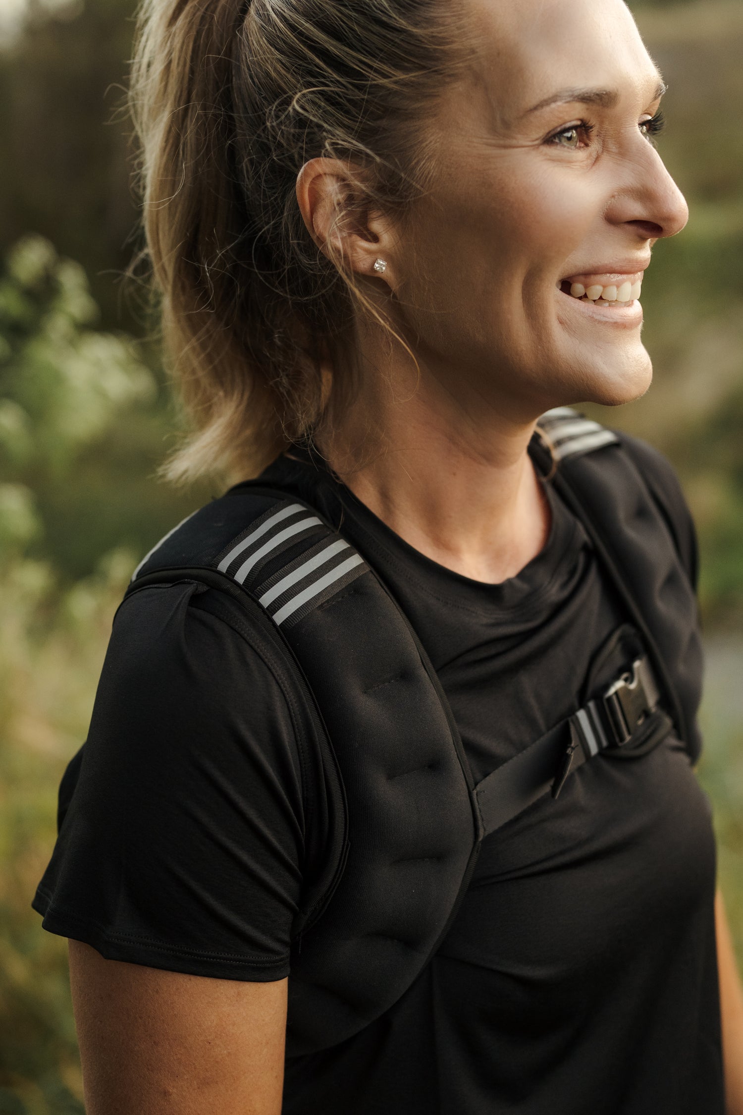 A lady wearing a black weighted VestFit NZ vest