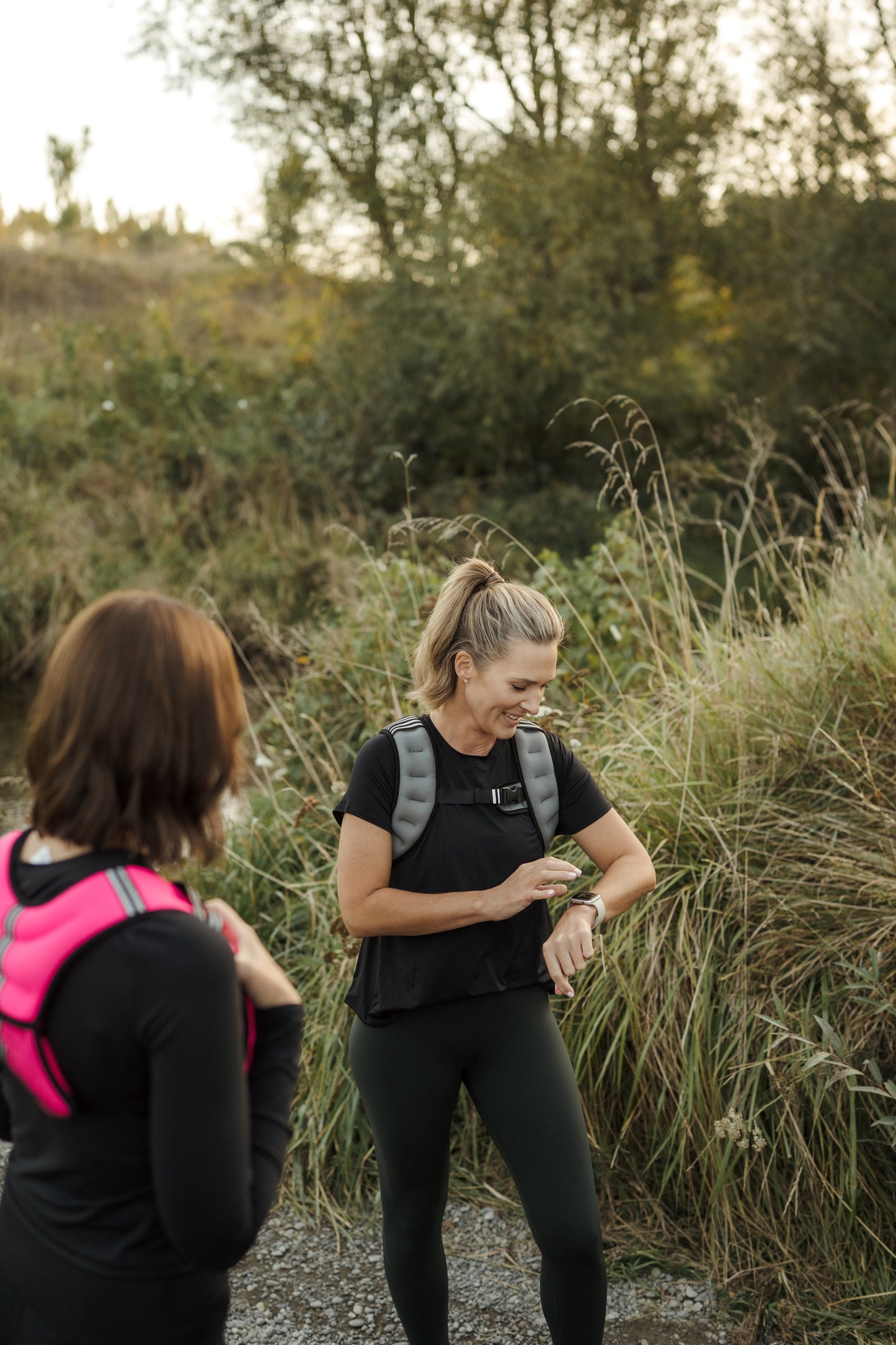 Two ladies exercising on a forest trail in VestFit NZ weighted vests